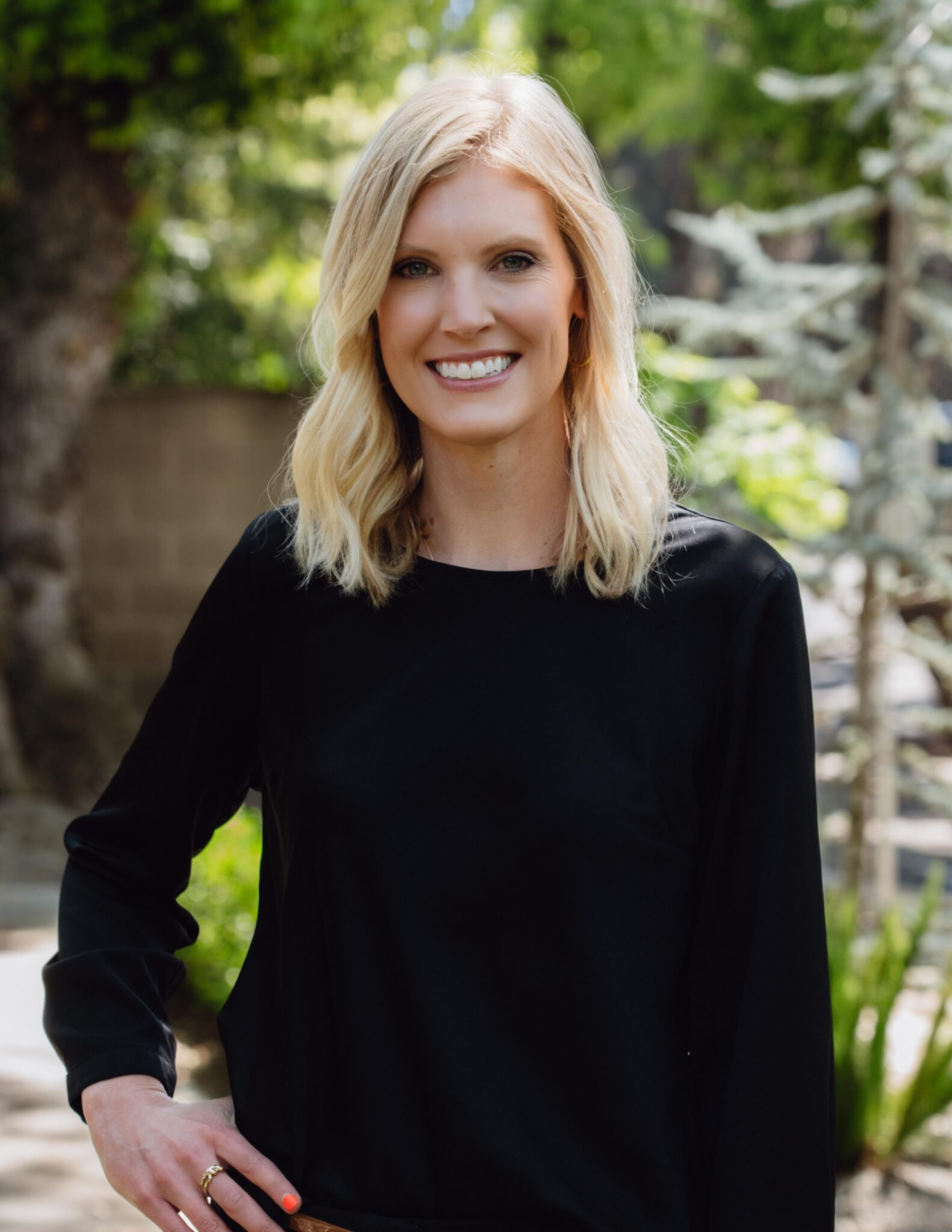 Devon Casida, founder of Novae Wellness, smiling outdoors